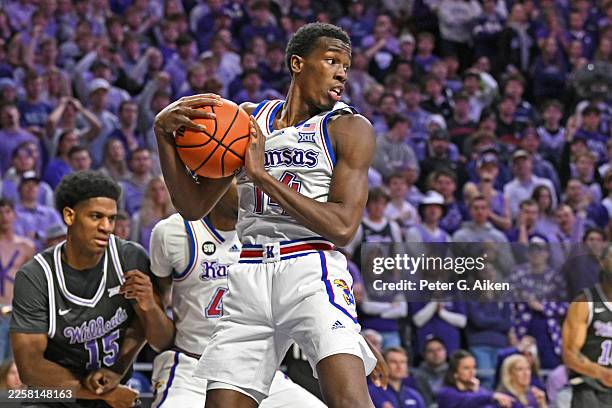 Melvin Council Jr. #14 of the Kansas Jayhawks grabs a defensive rebound against the Kansas State Wildcats in the second half at Bramlage Coliseum on...