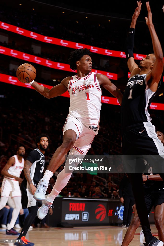 Houston Rockets Thompson Amen Thompson of the Houston Rockets passes the ball as Victor... News ...