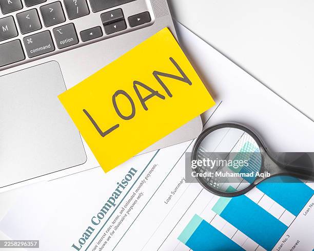 tools for understanding loan options in finance office during daytime hours - borrowing stock pictures, royalty-free photos & images