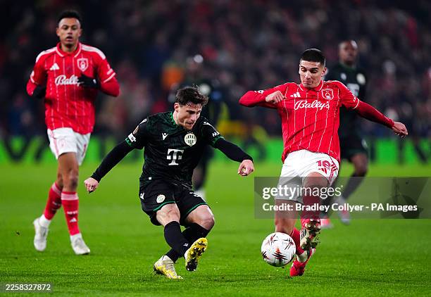 Ferencvaros' Gabi Kanichowsky and Nottingham Forest's Nicolas Dominguez during the UEFA Europa League match at the City Ground, Nottingham. Picture...