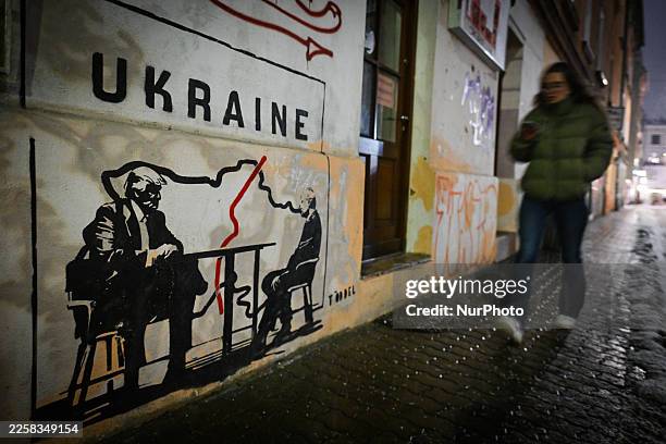 Mural titled 'Divided by Oligarchy' by anonymous Norwegian street artist Toddel, depicting U.S. President Donald Trump and Russian President Vladimir...