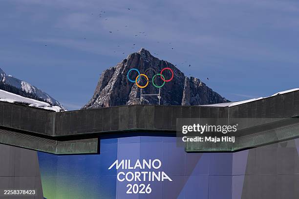 The Olympic Rings are set in front of surrounding mountains at Cortina Curling Olympic Stadium on January 26, 2026 in Cortina d'Ampezzo, Italy....