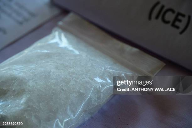 In this photo taken on January 24 a bag containing ice, also known as crystal methamphetamine, is seen displayed during a press tour of a drug...