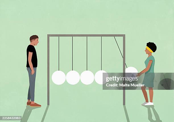 illustrazioni stock, clip art, cartoni animati e icone di tendenza di man and woman on opposite ends of newton's cradle against green background - fisica