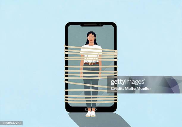 young woman strapped to large smart phone with rope - portrait blue background stock illustrations