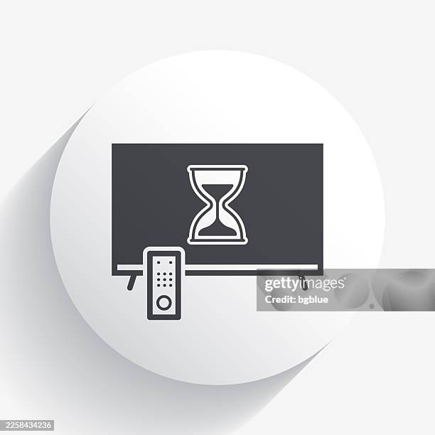 tv with hourglass. icon on circle button with long shadow - remote control white background stock illustrations