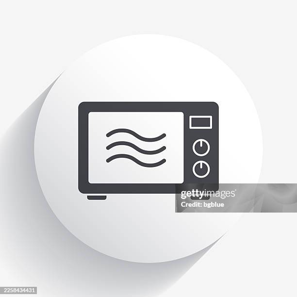 microwave oven. icon on circle button with long shadow - microwave button clip art stock illustrations