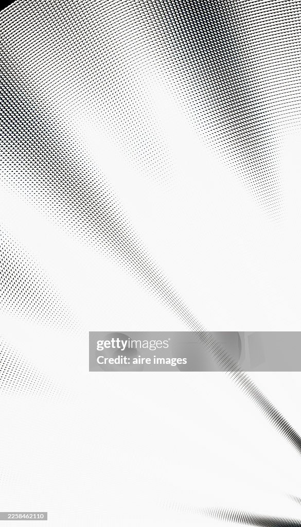 Black and white halftone pattern fading diagonal background