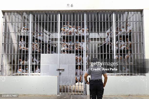 Prison officer guards a cell during a walk around at El Salvador CECOT mega prison in the municipality of Tecoluca on January 30, 2026 in Tecoluca,...