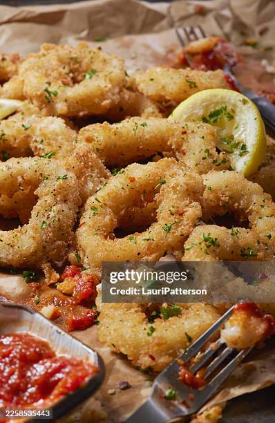 fried calamari with marinara sauce - calamari stock pictures, royalty-free photos & images