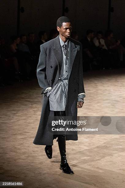 Model walks the runway during the Saint Laurent Menswear Fall/Winter 2026-2027 show as part of Paris Fashion Week on January 27, 2026 in Paris,...