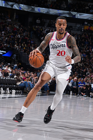 Denver Collins John Collins of the Los Angeles Clippers drives to the basket during ...