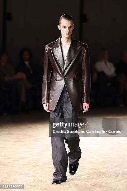 Model walks the runway during the Saint Laurent Menswear Fall/Winter 2026-2027 show as part of Paris Fashion Week on January 27, 2026 in Paris,...