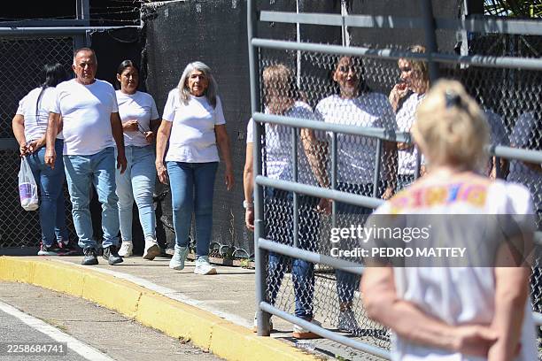 Relatives of political prisoners leave after visiting them at El Rodeo I prison in Guatire, Miranda state, about 30 kilometers east of Caracas, on...