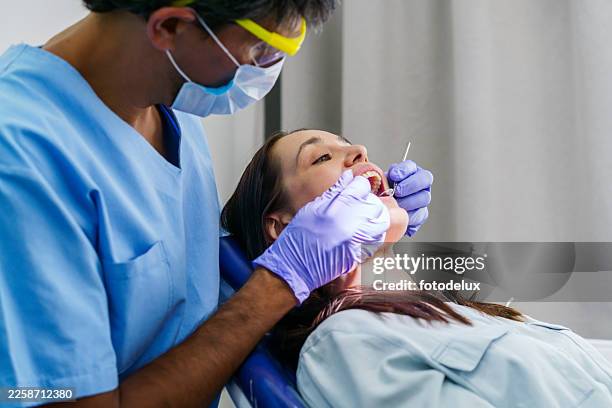 dental checkup in clinic with dentist and patient - clean mouth stock pictures, royalty-free photos & images