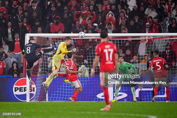 Anatoliy Trubin of Benfica scores his team's fourth goal with a header as Thibaut Courtois of Real Madrid fails to make a save during the UEFA...