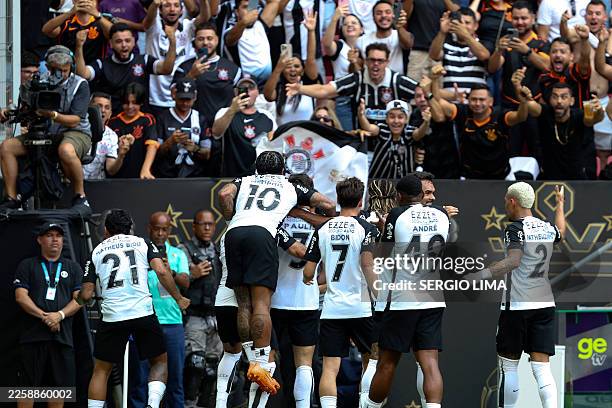Corinthians' defender Gabriel Paulista celebrates with teammates after scoring his team's first goal during the Supercopa do Brasil 2026 final...
