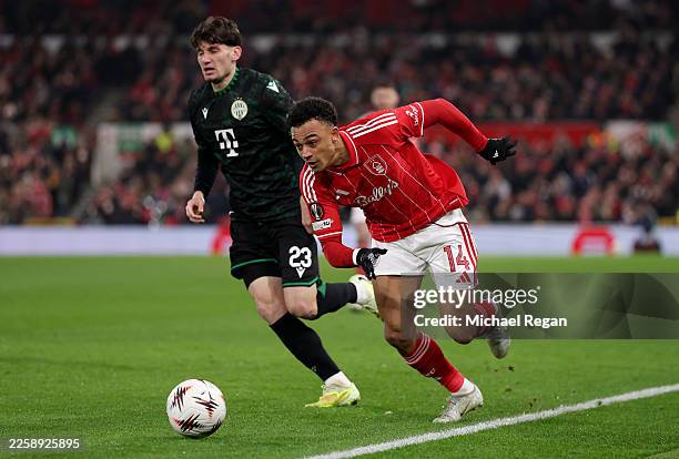 Dan Ndoye of Nottingham Forest runs with the ball whilst under pressure from Bence Otvos of Ferencvarosi TC during the UEFA Europa League 2025/26...