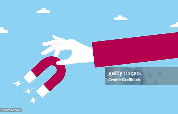 human hand holding magnet to demonstrate attraction power and customer acquisition strategy - lead generation stock illustrations