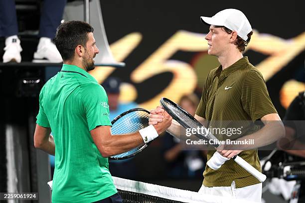 Novak Djokovic of Serbia shakes hands with Jannik Sinner of Italy after his victory in the Men's Singles Semifinal during day 13 of the 2026...