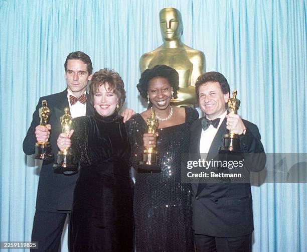 Top Oscar winners Jeremy Irons, Best Actor, Kathy Bates, Best Actress, Whoopi Goldberg, Best Supporting Actress, and Joe Pesci, Best Supporting Actor...