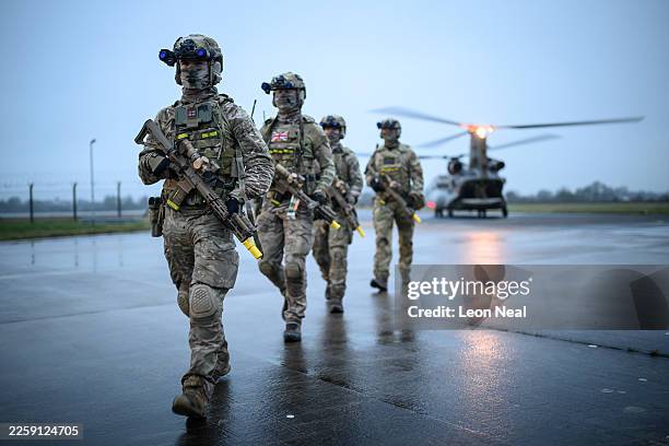 Members of the Special Operations Forces practise their rapid deployment techniques with a Mk.6 CH47 Chinook helicopter ahead of the following day's...