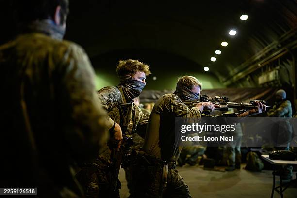 Members of the Special Operations Forces practise their building clearance techniques following a RoC drill for the following day's UK validation...
