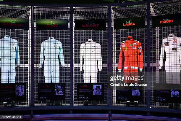 Driver race suit display at the reopening of the Grand Prix Plaza Formula 1 attraction on January 30, 2026 in Las Vegas, Nevada.