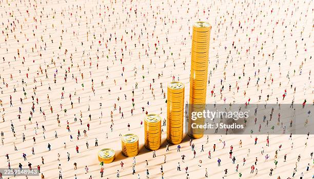horizontal high angle stacked gold coins and massive crowd representing global wealth and financial success - prosperity stock pictures, royalty-free photos & images