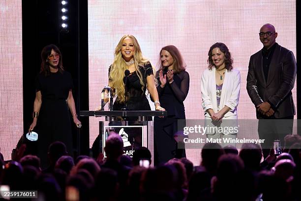 Honoree Mariah Carey accepts the 2026 MusiCares Person of the Year award from Jody Gerson, Theresa Wolters, Executive Director, MusiCares, Carianne...