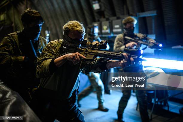 Members of the Special Operations Forces practise their building clearance techniques following a RoC drill for the following day's UK validation...