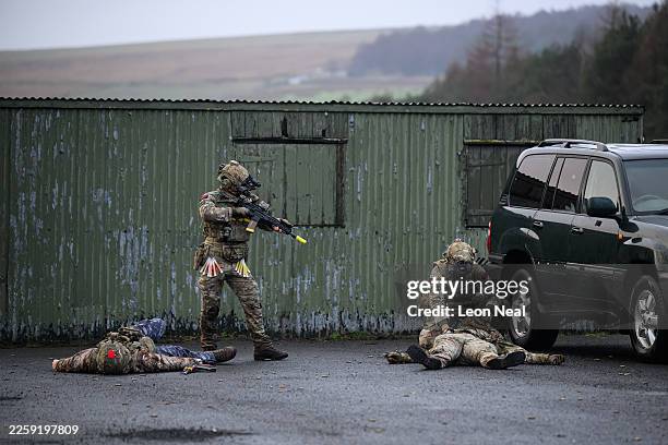 Members of the Special Operations Forces check biometric data on "killed" enemy fighters during a validation exercise on January 31, 2026 in...