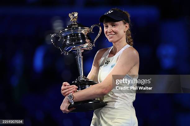 Elena Rybakina of Kazakhstan poses with the Daphne Akhurst Memorial Cup after her victory in the Women's Singles Final against Aryna Sabalenka during...
