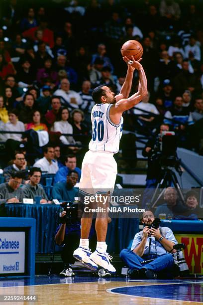 Dell Curry of the Charlotte Hornets shoots a 3-pointer against the Miami Heat at Charlotte Coliseum on December 27,1997 in Charlotte, North Carolina....