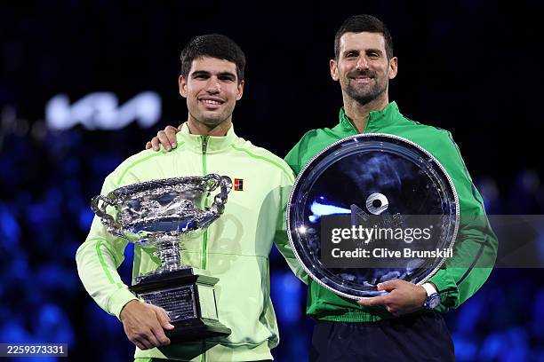 Winner Carlos Alcaraz of Spain and runner-up Novak Djokovic of Serbia pose at the presentation ceremony after the Men's Singles Final during day 15...