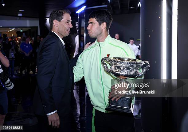 Carlos Alcaraz of Spain with Rafael Nadal and the Norman Brookes Challenge Cup after his victory in the Men's Singles Final against Novak Djokovic of...
