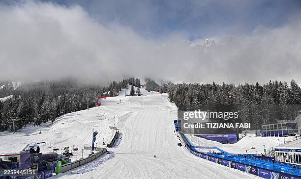 This photograph shows a general view of the slope and the women's downhill finish area ahead of the Milano Cortina 2026 Winter Olympic Games at the...