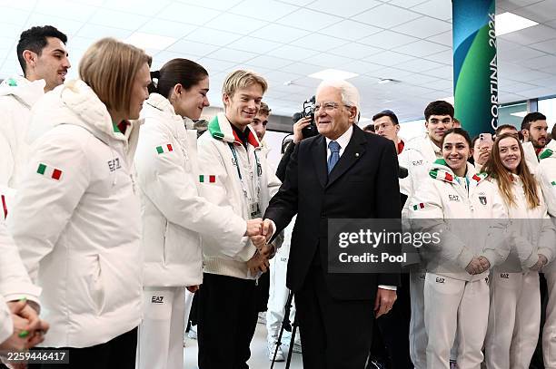 Italian President Sergio Mattarella shakes hands with Italian athletes as he visits the Milano Olympic Village on February 5, 2026 in Milan, Italy.