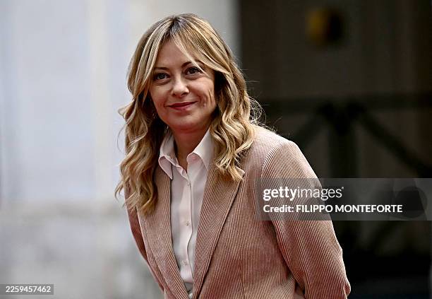 Italy's Prime Minister Giorgia Meloni smiles as she waits to welcome Chile's President-elect Jose Antonio Kast at Palazzo Chigi in Rome on Febuary 5,...