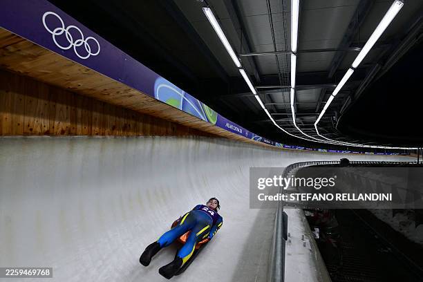 Ukraine's Yulianna Tunytska takes part in the luge women's singles training session at Cortina Sliding Centre during the Milano Cortina 2026 Winter...