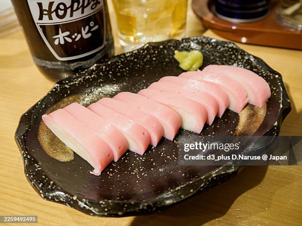 "itawasa" sashimi-style fish cake with wasabi.paired with hoppy (a beer-like carbonated shochu drink). - kamaboko stock pictures, royalty-free photos & images