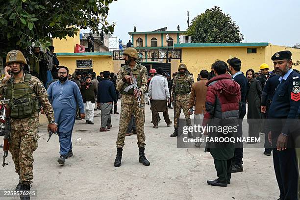 Security personnel stand guard outside a mosque following an explosion, in Islamabad on February 6, 2026. A blast at a Shiite mosque in Pakistan's...