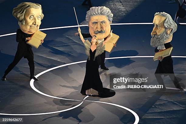 Italian actress Matilda De Angelis performs with dancers dressed as the three great masters of Italian opera Giuseppe Verdi, Giacomo Puccini and...