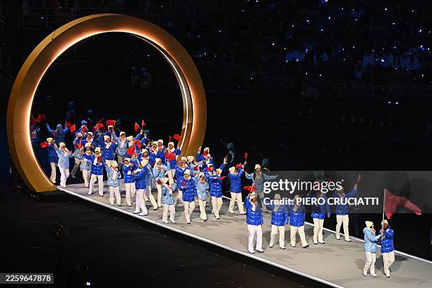 China's flag bearers Zhang Chutong and Ning Zhongyan parade with other athletes during the opening ceremony of the Milano Cortina 2026 Winter Olympic...