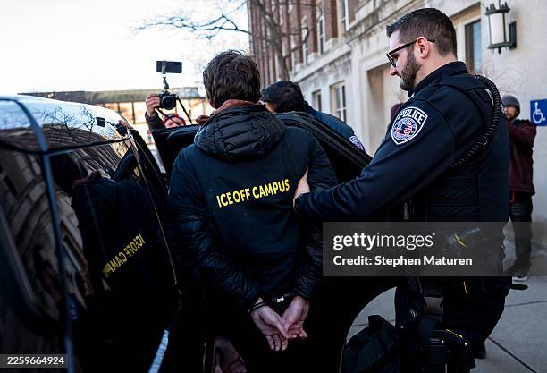 Student is arrested by University of Minnesota Police after chaining themselves to the door of Morrill Hall on February 6, 2026 in Minneapolis,...