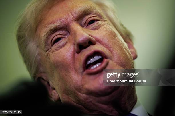 President Donald Trump gaggles with reporters while aboard Air Force One on February 6, 2026 en route to Palm Beach, Florida. The President is...