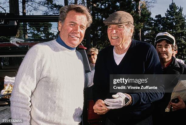 American actors Robert Wagner and Burt Lancaster at the AT&T Pebble Beach Pro-Am golf tournament at Pebble Beach, California, February 1990.