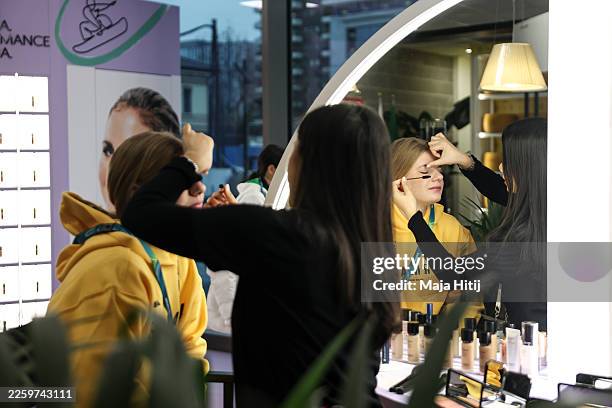 Nina Christof ice hockey player from Germany gets a make up done in a salon in Olympic Village during Media Day on day minus three of the Milano...