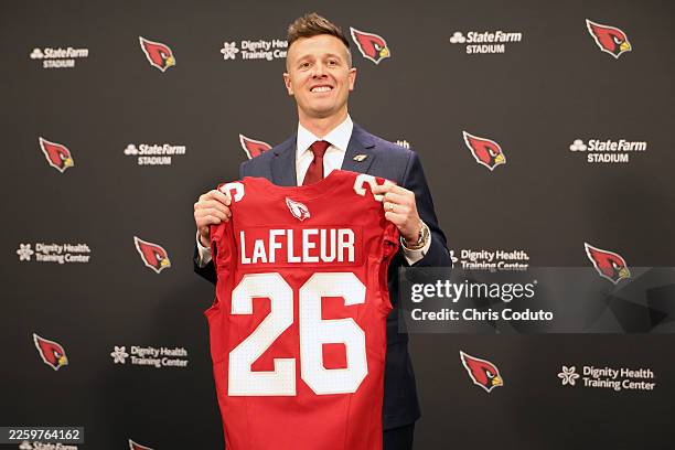 New Arizona Cardinals head coach Mike LaFleur poses for a photo during a press conference at Dignity Health Arizona Cardinals Training Center on...