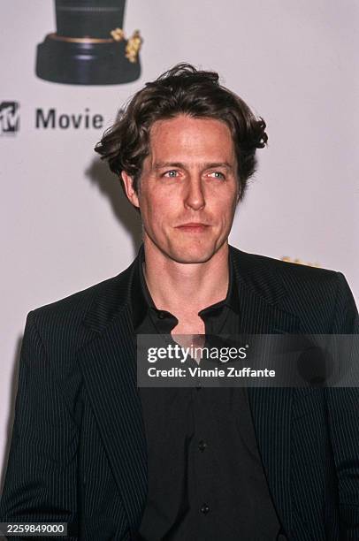 English actor Hugh Grant attends the Eighth Annual MTV Movie Awards at The Barker Hangar, Santa Monica Air Center in Santa Monica, California, 5th...